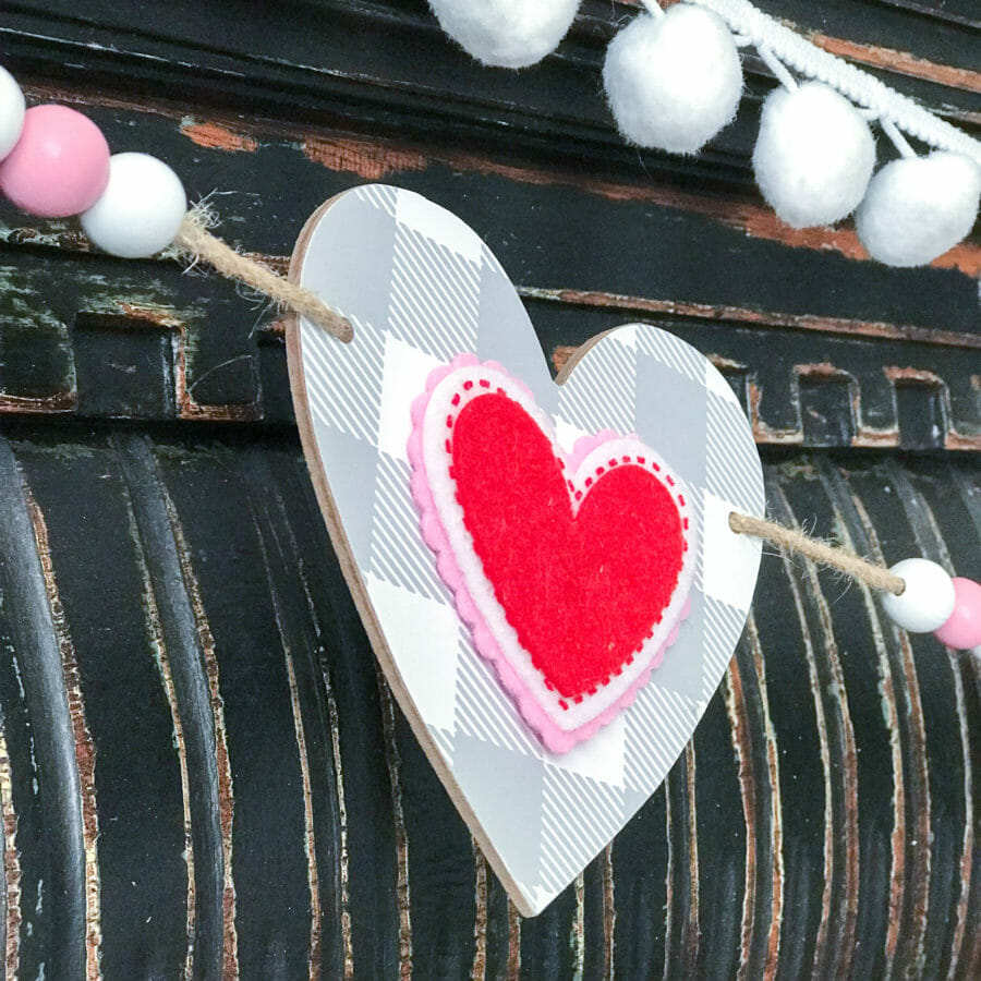 heart garland on black mantel close up