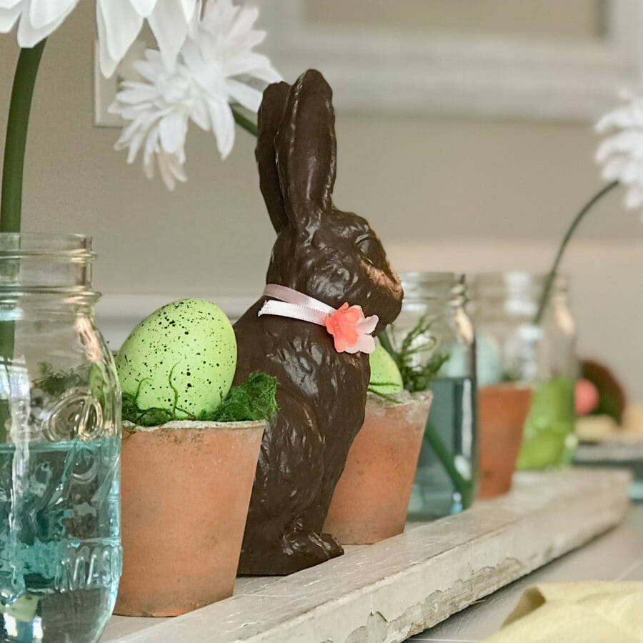 mason jars with bunny and eggs in clay pots