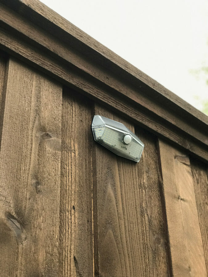 close up of solar light on back fence