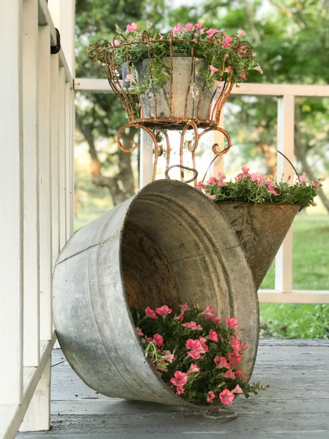 3 vintage galvanized buckets with flowers
