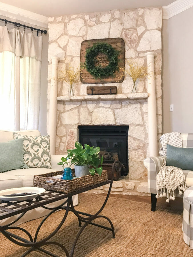 stone fireplace with chair and blanket