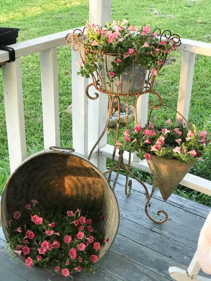 3 galvanized buckets with flowers
