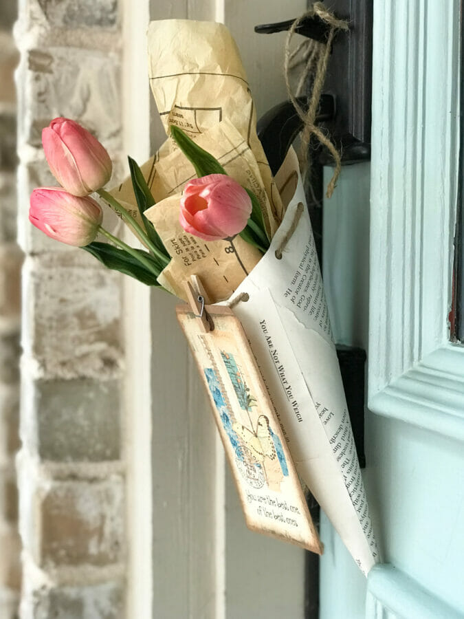 paper cone hanging on door with flowers close up