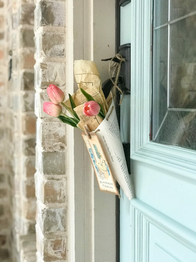paper cone hanging on door with flowers