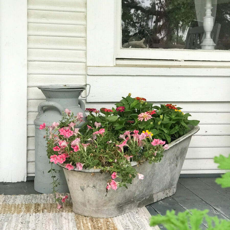 baby tub with flowers and milk can