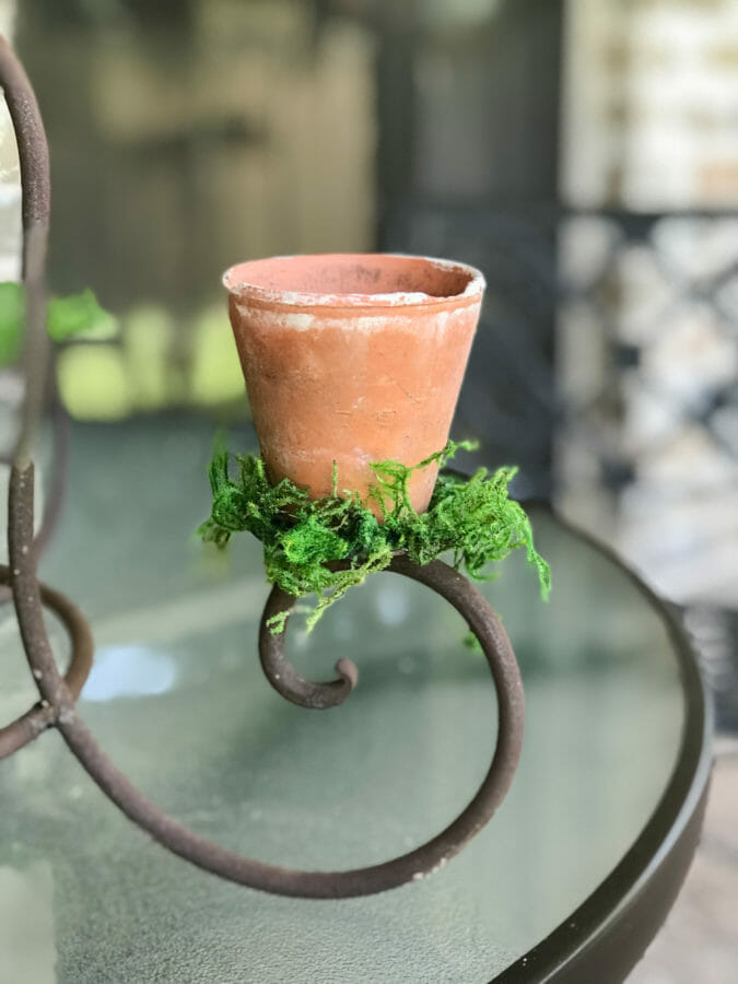 vintage clay pot on repurposed candelabra