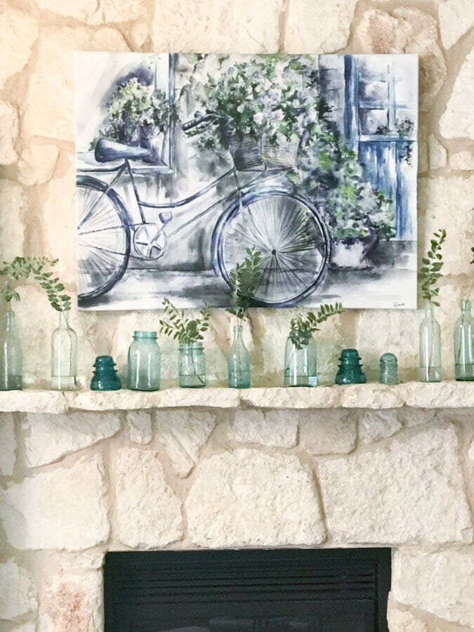 Summer mantel with bicycle print and vintage blue bottles