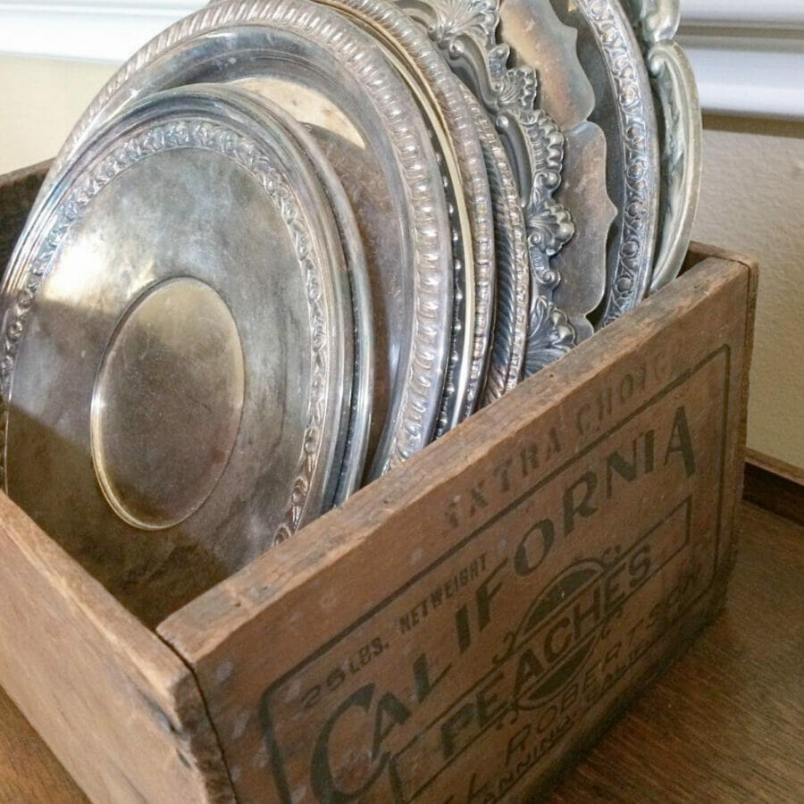 Vintage crate with silver platters