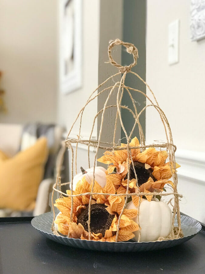 grapevine wire cloche with white pumpkins and sunflowers