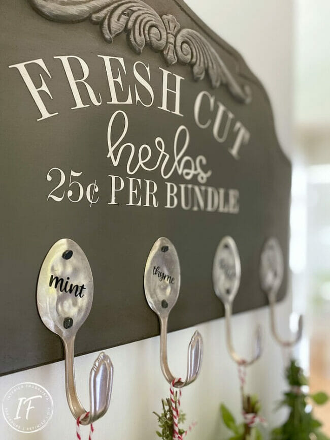 herb sign with spoons as hooks