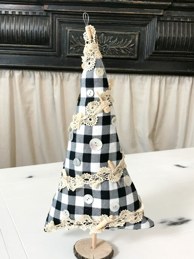 black and white checked fabric tree with tiny kitchen utensils and lace sewn on tree