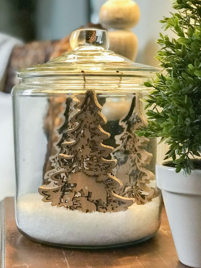 Close up of wooden cut out ornaments in jar