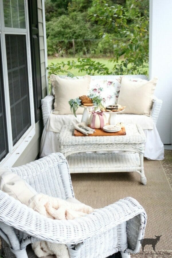 white wicker seating with fall color