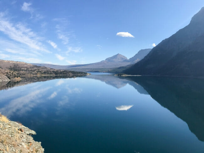 Lake with reflection of sky and mountains