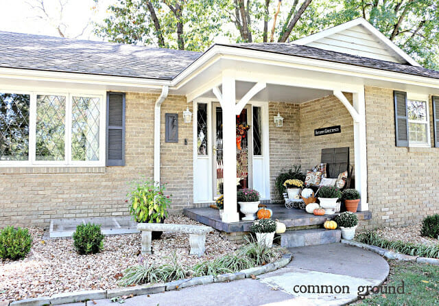 porch with mums and pumpkins