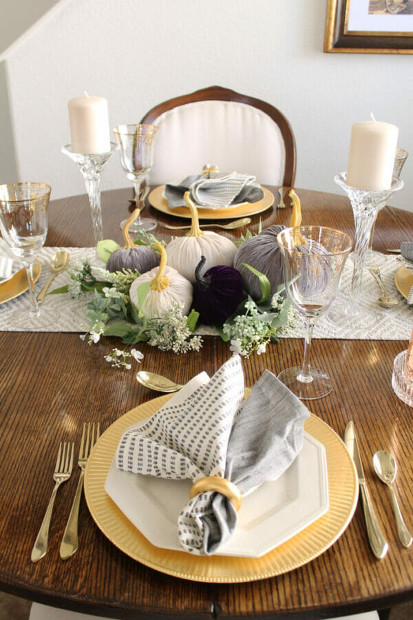 Gold charges and velvet pumpkin centerpiece