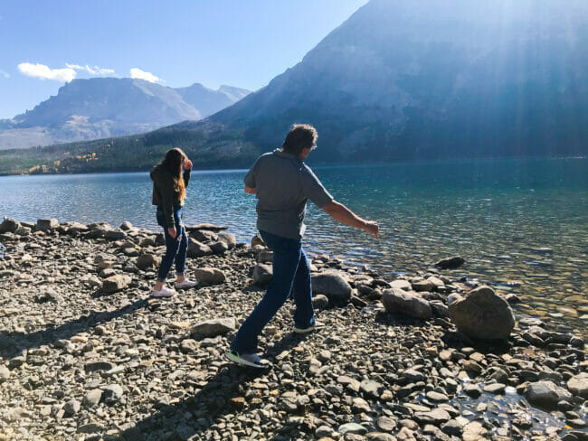 skipping rocks on Lake McDonald in Glacier National Park