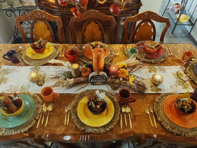 thanksgiving table with candles and corn