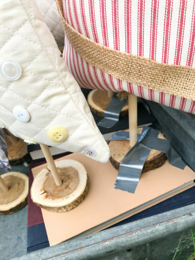 fabric trees with wooden bases taped to books