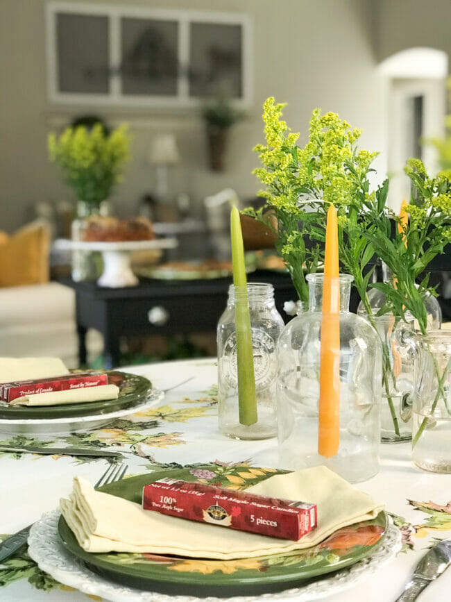 place setting with green and gold candles