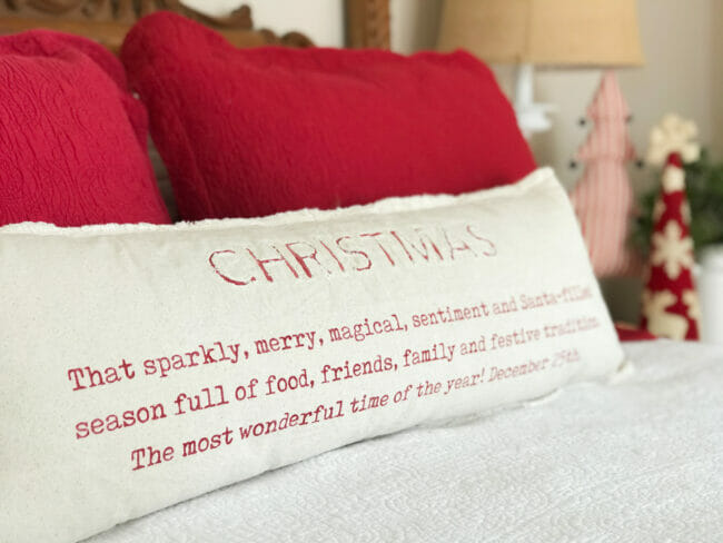 Christmas pillow on bed