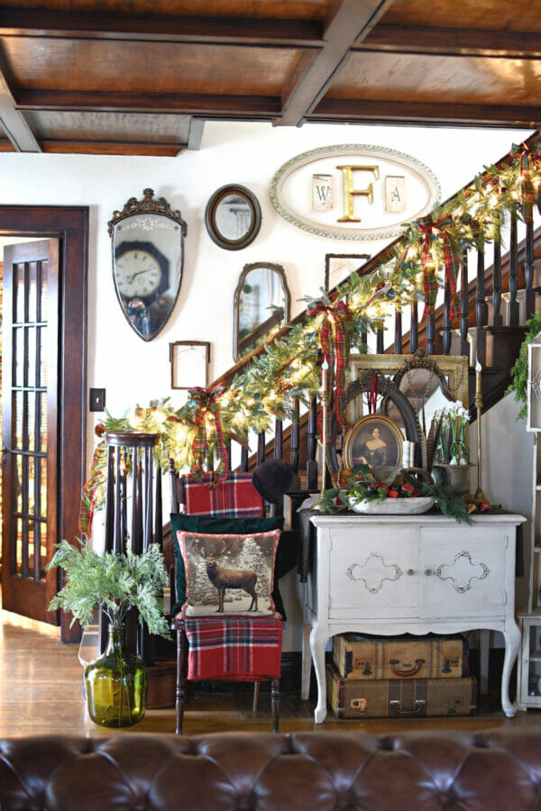 Christmas entry with staircase and frames on wall