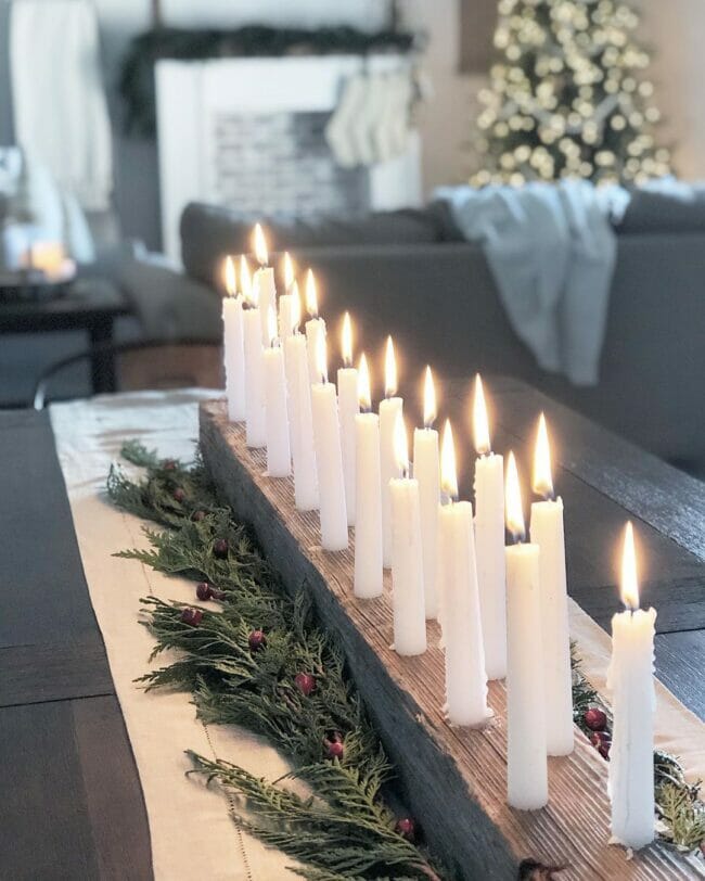 long board with white tapered candles