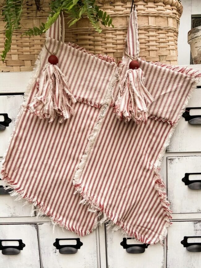 red ticking stockings hanging on file cabinet