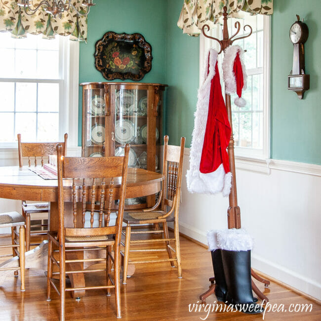 dining room with Santa suit on coat rack