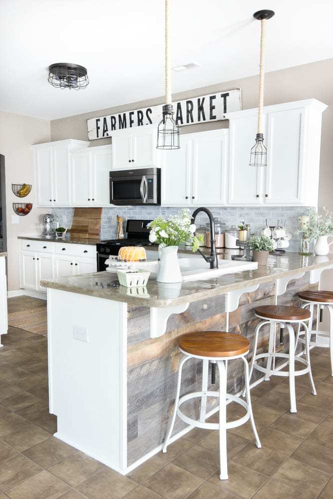 white kitchen with large farmhouse sign