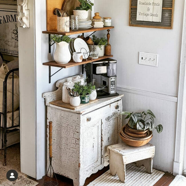 white vintage hutch with coffee station