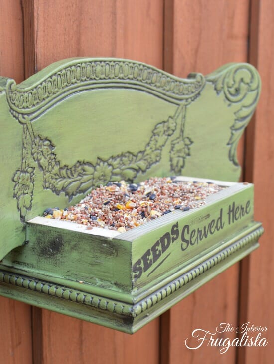 green DIY birdfeeder with seeds