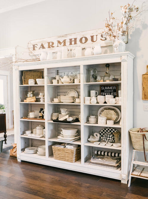 white hutch with collection of ironstone