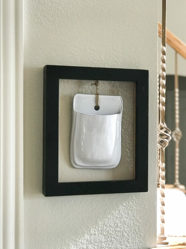 black frame with white wall pocket
