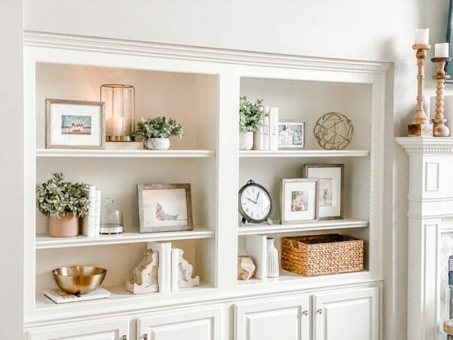 white bookshelves with neutral decor