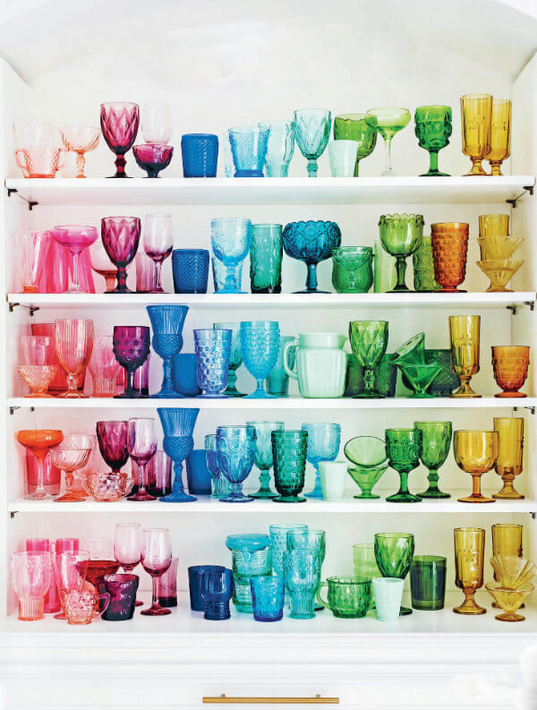 rainbow of glass pieces on shelves