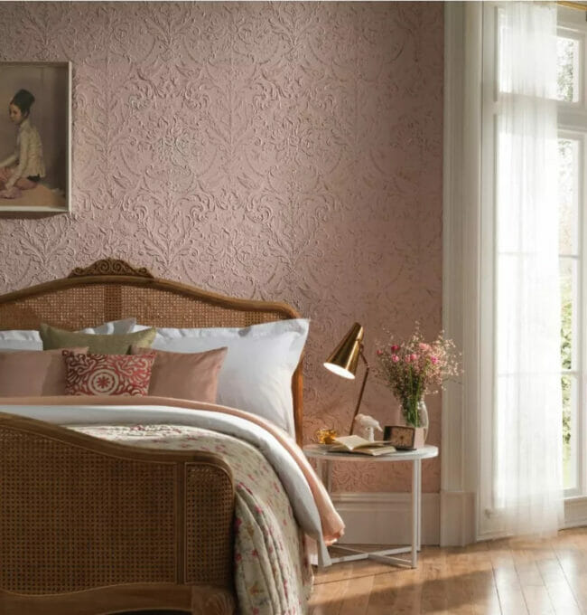 bedroom with pink embossed wallpaper