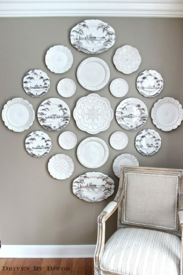 taupe wall with collage of white plates