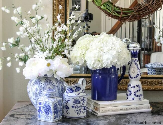 blue and white vases with flowers