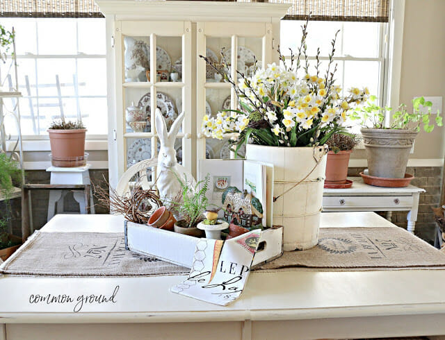 spring farmhouse centerpiece with bucket of flowers