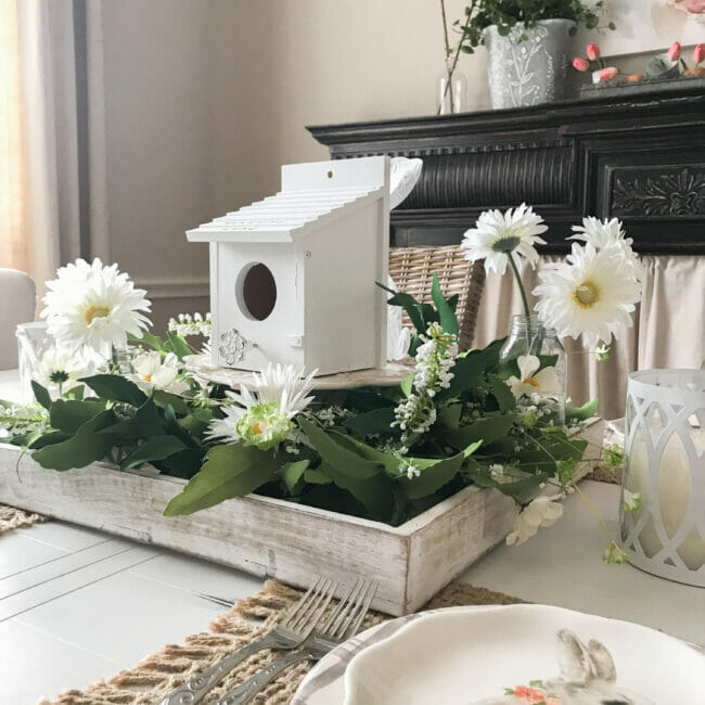 spring centerpiece with birdhouse and wreath