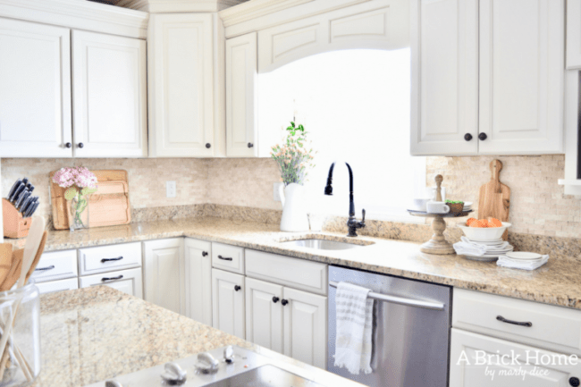 white cabinets with spring decor in kitchen