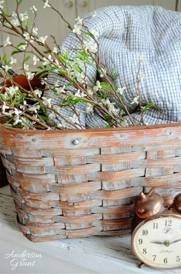 basket with flowers and clock