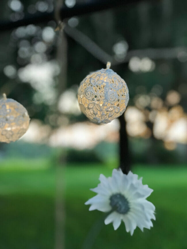 close up photo of crocheted string light balls