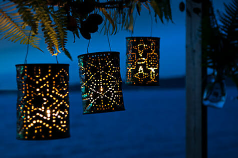 night sky with decorative cans hanging from tree