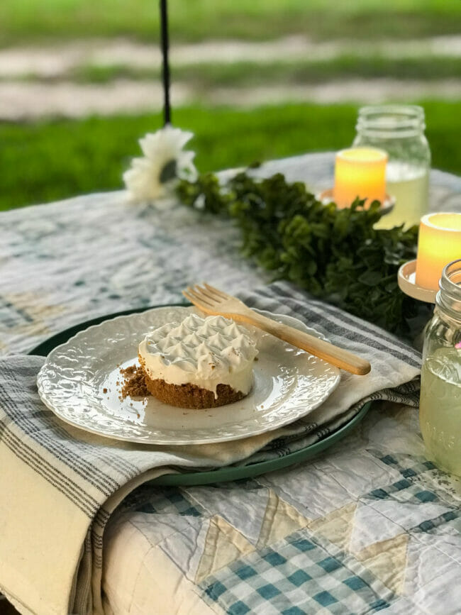 key lime pie on plate with wooden fork