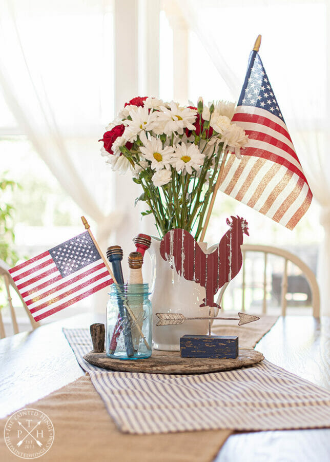 patriotic centerpiece sith flags, red rooster and white flowers