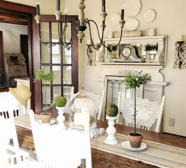 dining room with table, mantel and french door