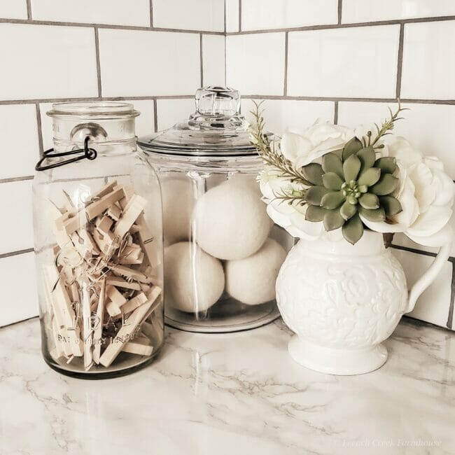 glass jars with clothespins and laundry balls