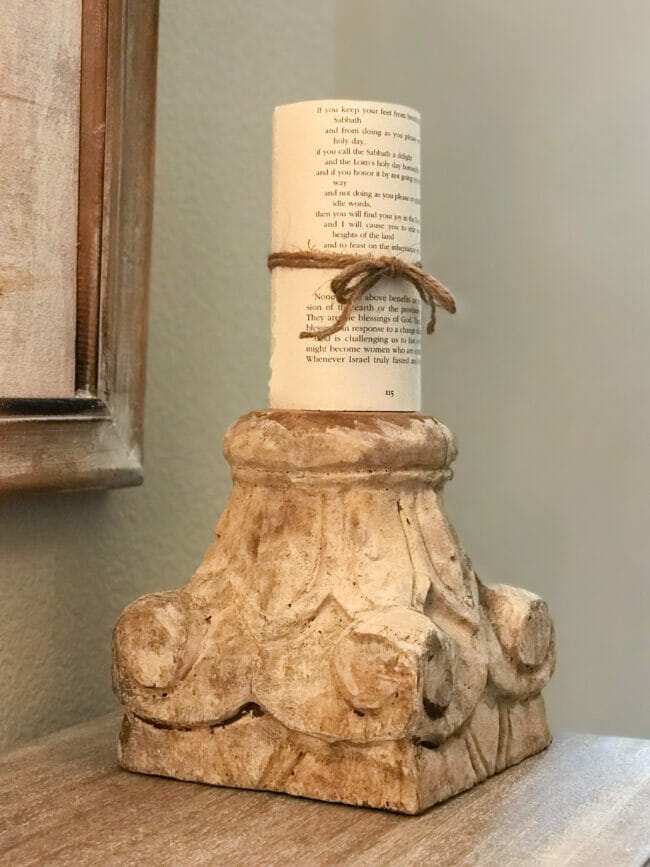 column top candle holder with pillar candle wrapped in book pages